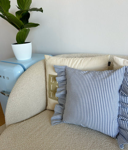 Cushion cover in a blue-striped stream wave