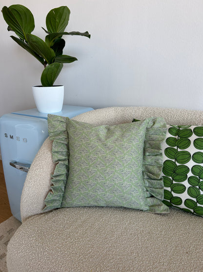 Cushion cover in green patterned fabric