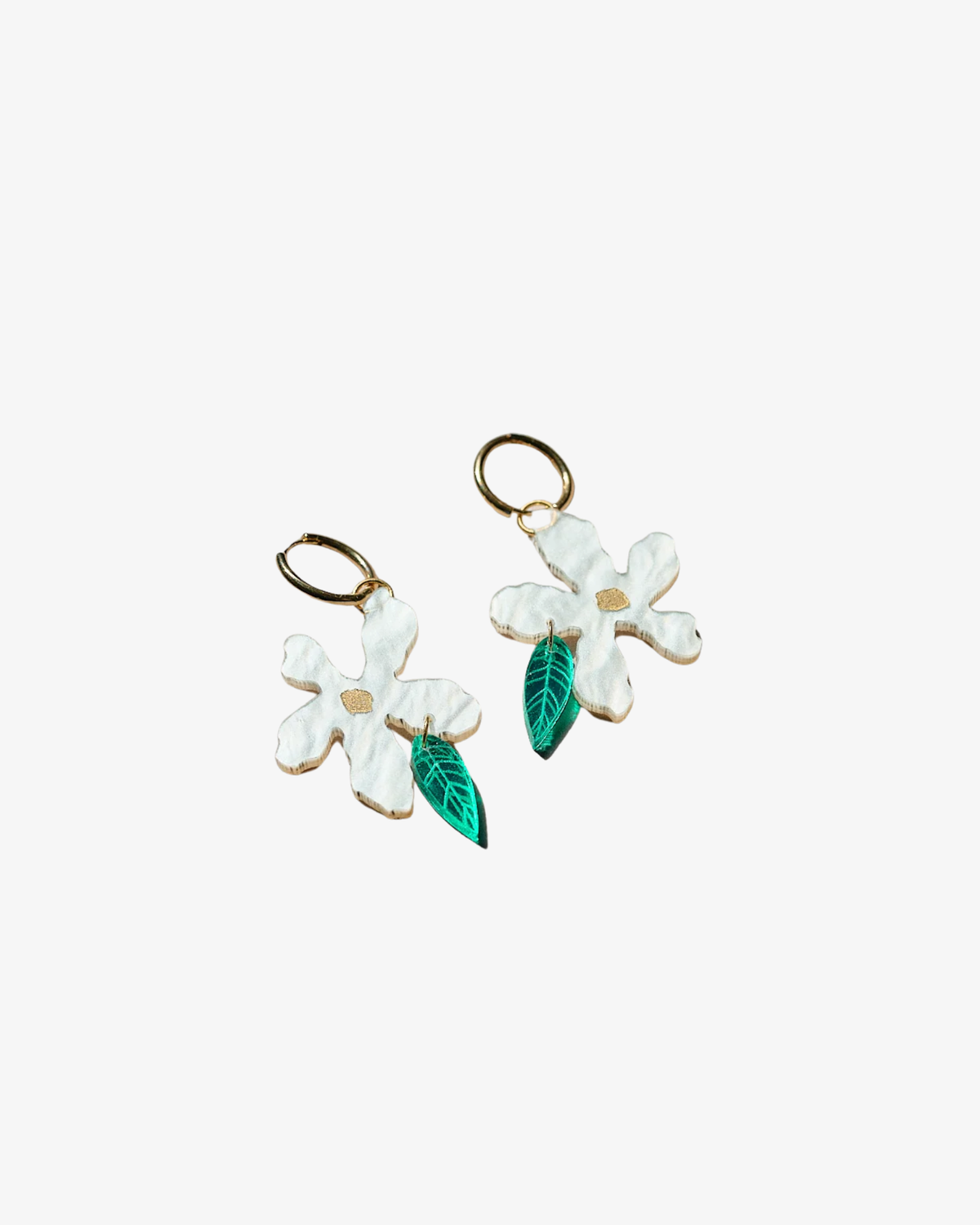 Golden hoop earring with flower pendant