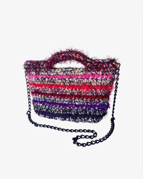 The black, white, and red striped bag.